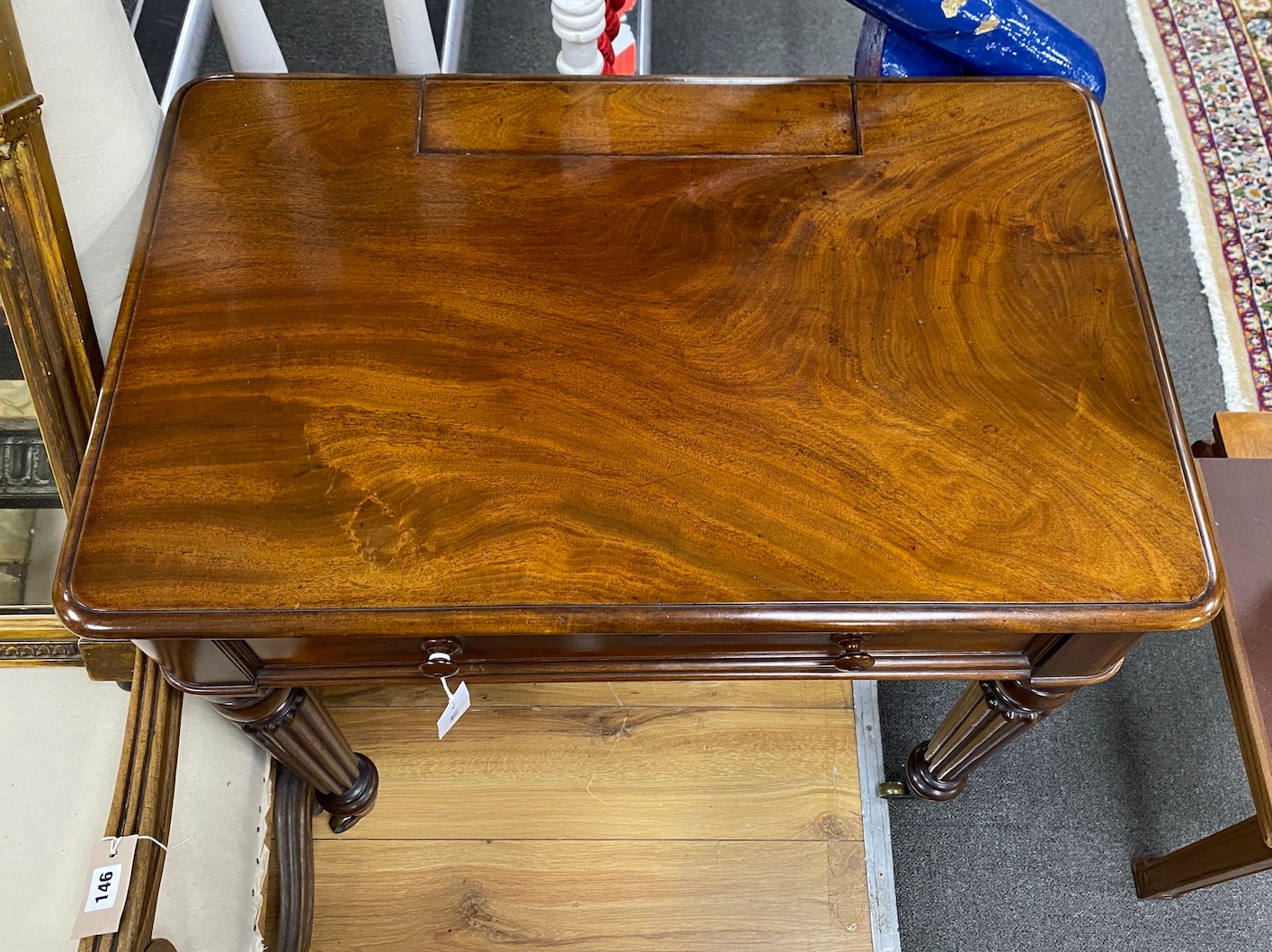 An early Victorian mahogany writing table stamped M Willson, 68 Great Queen Street, width 76cm, depth 48cm, height 74cm